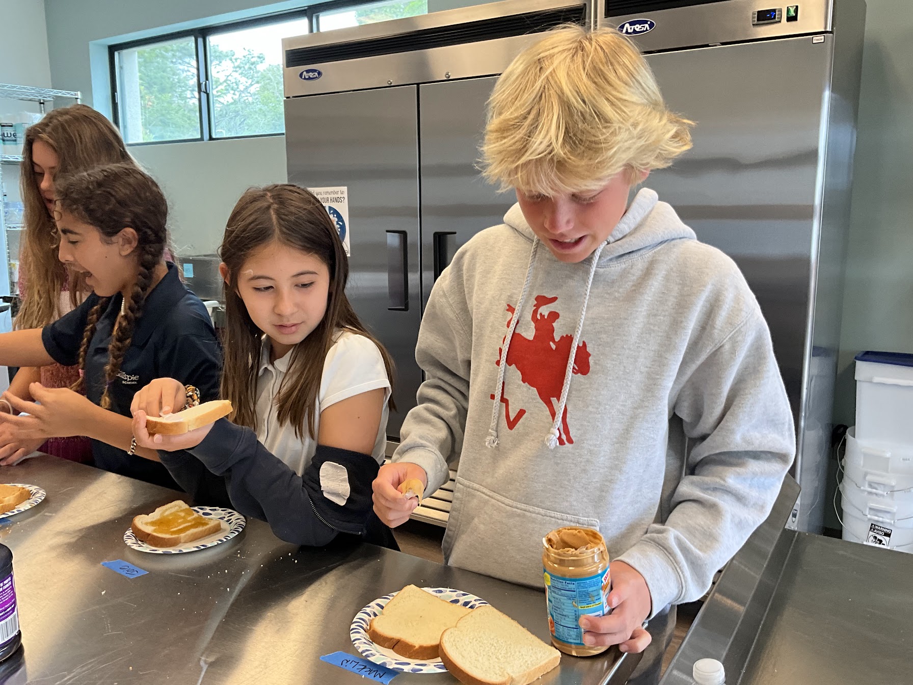 kids making peanut butter sandwiches