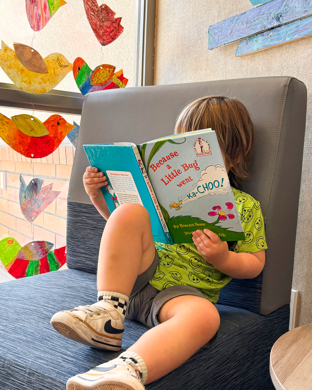 Gillispie Summer Reading Lists Gillispie PreK student reading a Dr. Seuss book