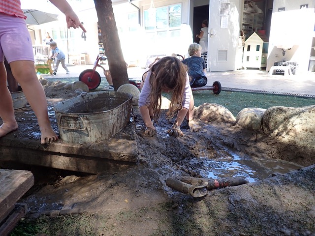 Gillispie Students Playing in the Mud in the Outdoor Classroom
