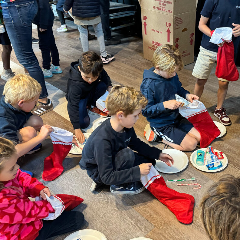 Gillispie Students fill stockings with necessities for Urban Street Angels and Ronald McDonald House